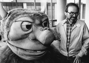 FILE - In this Sept. 25, 1985 file photo, author Maurice Sendak poses with one of the characters from his book "Where the Wild Things Are," designed for the operatic adaptation of his book in St. Paul, Minn. Sendak died, Tuesday, May 8, 2012 at Danbury Hospital in Danbury, Conn. He was 83. (AP Photo, file)