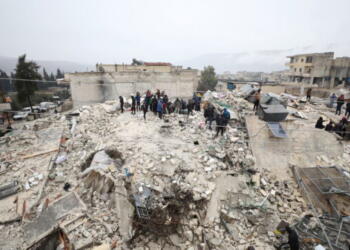 epa10450732 Rescuers work at the site of a collapsed building following an earthquake in Armanaz town, Idlib Governorate, Syria 06 February 2023. According to the US Geological Service, an earthquake with a preliminary magnitude of 7.8 struck southern Turkey close to the Syrian border, causing buildings to collapse and sending shockwaves over northwest Syria, Cyprus, and Lebanon. At least 221 people were killed and 419 injured in northwest Syria, with hundreds remaining trapped under the rubble, according to the White Helmets group, the Syria Civil Defence operating in the area.  EPA/YAHYA NEMAH