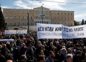 Protesters take part in a demonstration in front of the parliament building, following the collision of two trains, near the city of Larissa, in Athens, Greece, March 5, 2023. The banner reads "It was not a human mistake - Union of Hellenic Train Workers" REUTERS/Alkis Konstantinidis