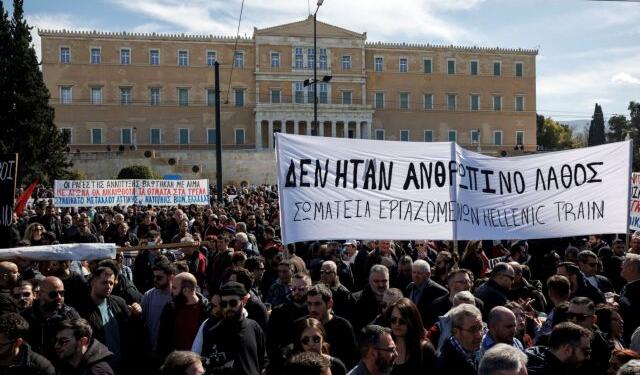 Protesters take part in a demonstration in front of the parliament building, following the collision of two trains, near the city of Larissa, in Athens, Greece, March 5, 2023. The banner reads "It was not a human mistake - Union of Hellenic Train Workers" REUTERS/Alkis Konstantinidis