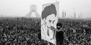 Demonstrators hold up a poster of exiled Shiite Muslim leader Ayatollah Khomeini during an anti-shah demonstration in Tehran, the Iranian capital, on Dec. 10, 1978. The Iranian revolution in 1979 had a powerful effect on the wider Muslim world, particularly among Shiites.