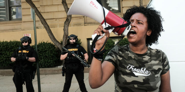 Members of the Sheriff's department stand in riot gear as demonstrators gather outside Akron City Hall to protest the killing of Jayland Walker, shot by police, in Akron, Ohio, July 3, 2022. - Several hundred protesters marched Sunday in Akron, Ohio after the release of body camera footage that showed police fatally shooting a Black man with several dozen rounds of bullets.As anger rose over the latest police killing of a Black man in the United States, and authorities appealed for calm, a crowd marched to City Hall carrying banners with slogans such as "Justice for Jayland." (Photo by Matthew Hatcher / AFP) (Photo by MATTHEW HATCHER/AFP via Getty Images)