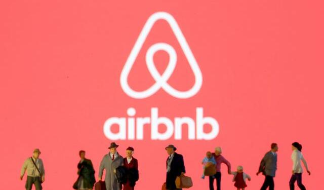 FILE PHOTO: Small toy figures are seen in front of diplayed Airbnb logo in this illustration taken March 19, 2020. REUTERS/Dado Ruvic/Illustration/File Photo