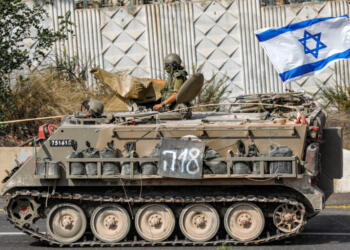 An Israeli army tracked medical vehicle moves along a road near the northern town of Kiryat Shmona close to the border with Lebanon on October 31, 2023 amid increasing cross-border tensions between Hezbollah and Israel as fighting continues in the south with Hamas militants in the Gaza Strip. (Photo by Jalaa MAREY / AFP)