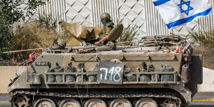An Israeli army tracked medical vehicle moves along a road near the northern town of Kiryat Shmona close to the border with Lebanon on October 31, 2023 amid increasing cross-border tensions between Hezbollah and Israel as fighting continues in the south with Hamas militants in the Gaza Strip. (Photo by Jalaa MAREY / AFP)
