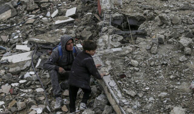 epa11229082 Palestinians search for missing people under the rubble of the destroyed house of the Al Hajj family following an Israeli air strike, in Al Nusairat refugee camp, southern Gaza Strip, 19 March 2024. According to the Palestinian Ministry of Health, more than 10 members of the same family were killed and six remain trapped under the rubble following an overnight Israeli air strike. More than 31,500 Palestinians and over 1,300 Israelis have been killed, according to the Palestinian Health Ministry and the Israel Defense Forces (IDF), since Hamas militants launched an attack against Israel from the Gaza Strip on 07 October 2023, and the Israeli operations in Gaza and the West Bank which followed it.  EPA/MOHAMMED SABER