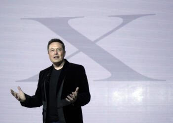 FILE - Elon Musk, CEO of Tesla Motors Inc., introduces the Model X car at the company's headquarters Tuesday, Sept. 29, 2015, in Fremont, Calif. Musk may want to send “tweet” back to the birds, but the ubiquitous term for posting on the site he now calls X is here to stay, at least for now.  For one, the word is still plastered all over the website formerly known as Twitter. Write a post, you still need to press a blue button that says “tweet” to publish it. To repost it, you still tap “retweet.”  (AP Photo/Marcio Jose Sanchez, File)