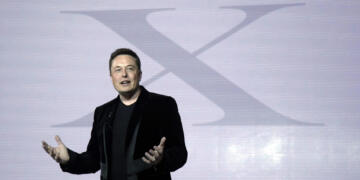 FILE - Elon Musk, CEO of Tesla Motors Inc., introduces the Model X car at the company's headquarters Tuesday, Sept. 29, 2015, in Fremont, Calif. Musk may want to send “tweet” back to the birds, but the ubiquitous term for posting on the site he now calls X is here to stay, at least for now.  For one, the word is still plastered all over the website formerly known as Twitter. Write a post, you still need to press a blue button that says “tweet” to publish it. To repost it, you still tap “retweet.”  (AP Photo/Marcio Jose Sanchez, File)