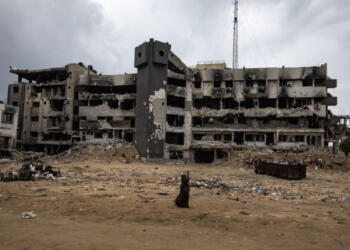 epa11876289 A person walks among the rubble of the damaged Al-Shifa hospital, amid a ceasefire between Israel and Hamas, in Gaza City, Gaza Strip, 05 February 2025. Israel and Hamas implemented the first phase of a hostage release and ceasefire deal on 19 January 2025. More than 46,000 Palestinians have been killed in the Gaza Strip, according to the Palestinian Ministry of Health, since Israel launched a military campaign in the strip in response to a cross-border attack led by the Palestinian militant group Hamas on 07 October 2023, in which about 1,200 Israelis were killed and more than 250 taken hostage.  EPA/HAITHAM IMAD