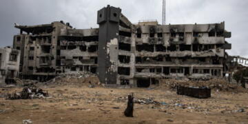 epa11876289 A person walks among the rubble of the damaged Al-Shifa hospital, amid a ceasefire between Israel and Hamas, in Gaza City, Gaza Strip, 05 February 2025. Israel and Hamas implemented the first phase of a hostage release and ceasefire deal on 19 January 2025. More than 46,000 Palestinians have been killed in the Gaza Strip, according to the Palestinian Ministry of Health, since Israel launched a military campaign in the strip in response to a cross-border attack led by the Palestinian militant group Hamas on 07 October 2023, in which about 1,200 Israelis were killed and more than 250 taken hostage.  EPA/HAITHAM IMAD