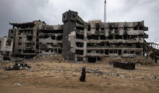 epa11876289 A person walks among the rubble of the damaged Al-Shifa hospital, amid a ceasefire between Israel and Hamas, in Gaza City, Gaza Strip, 05 February 2025. Israel and Hamas implemented the first phase of a hostage release and ceasefire deal on 19 January 2025. More than 46,000 Palestinians have been killed in the Gaza Strip, according to the Palestinian Ministry of Health, since Israel launched a military campaign in the strip in response to a cross-border attack led by the Palestinian militant group Hamas on 07 October 2023, in which about 1,200 Israelis were killed and more than 250 taken hostage.  EPA/HAITHAM IMAD